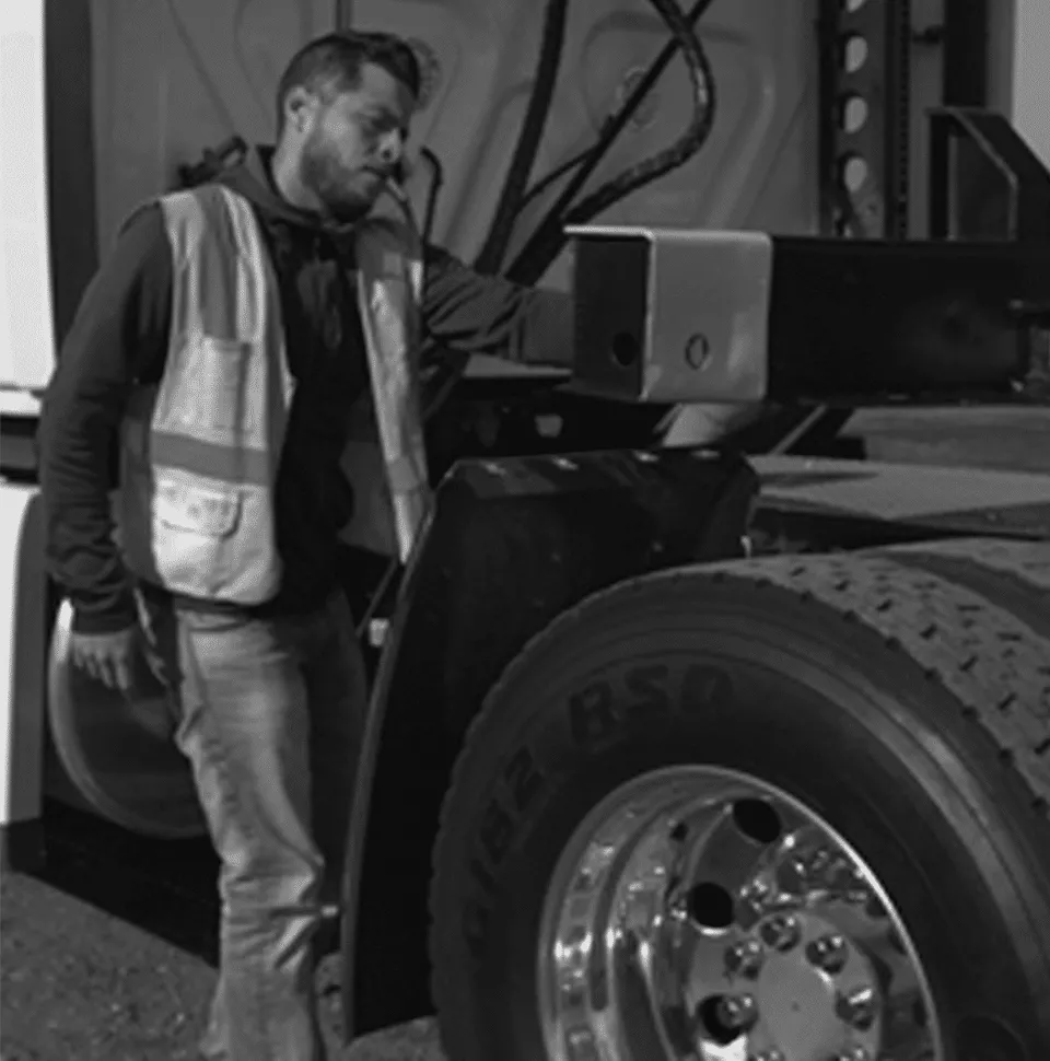 Safety Always Core Value 960x970 Trucker checking a DCLI chassis