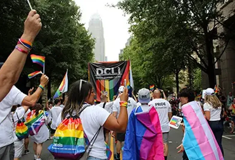 Pride Parade Rainbox Employees Marching 784x534 Clt pride parade employees marching