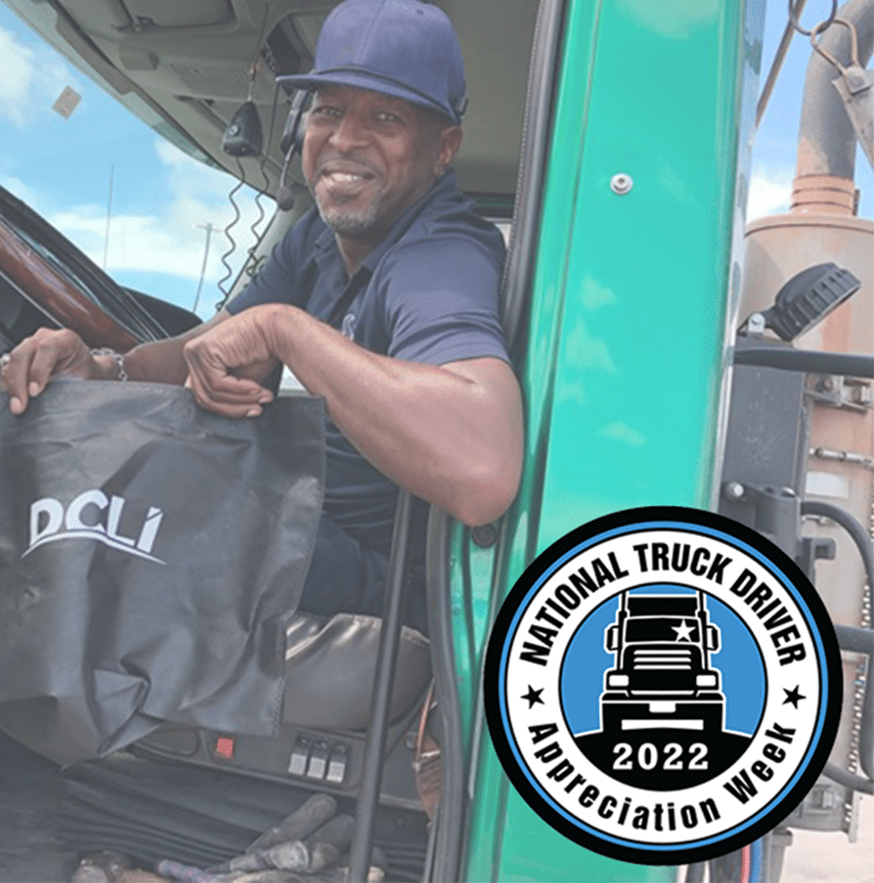 Image of a trucker sitting in truck holding a DCLI bag