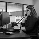 DCLI employee answering phone in the office