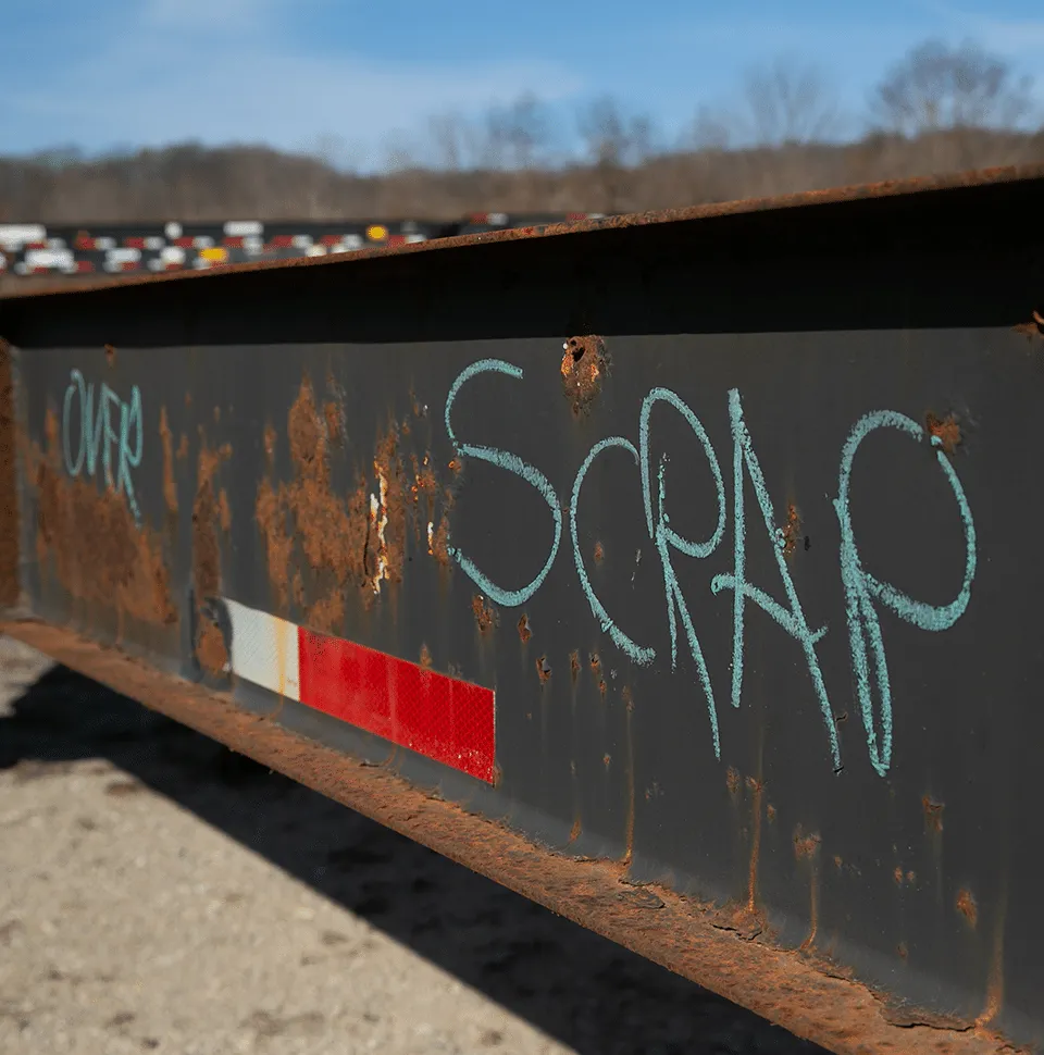 out of service DCLI chassis with scrap painted on the side