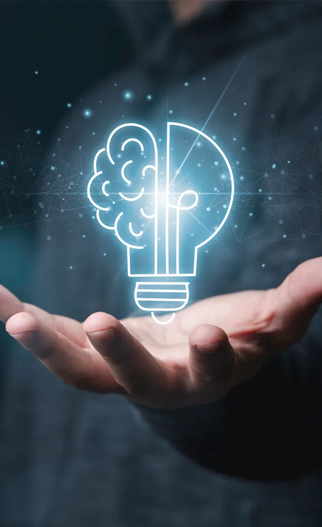 image of business man's hand with light bulb above it